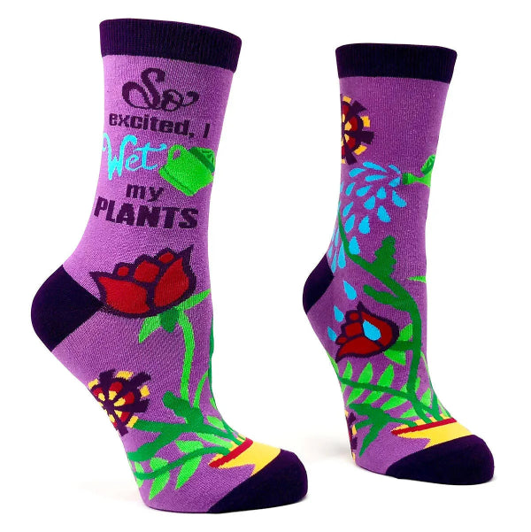 Purple socks with plant-themed design and text on a white background