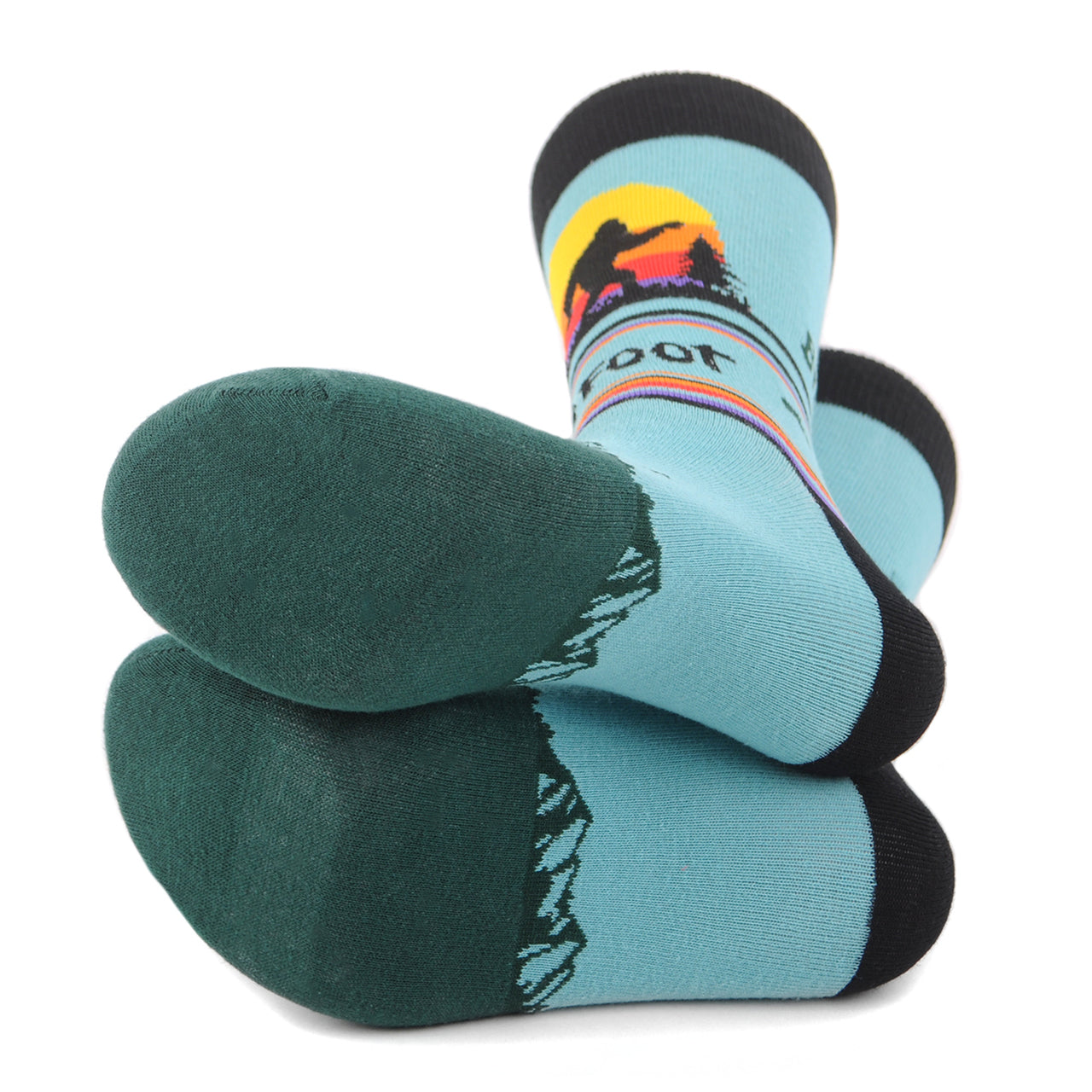 Men's crew socks with Bigfoot silhouette, footprints, mountains and a colorful sunset