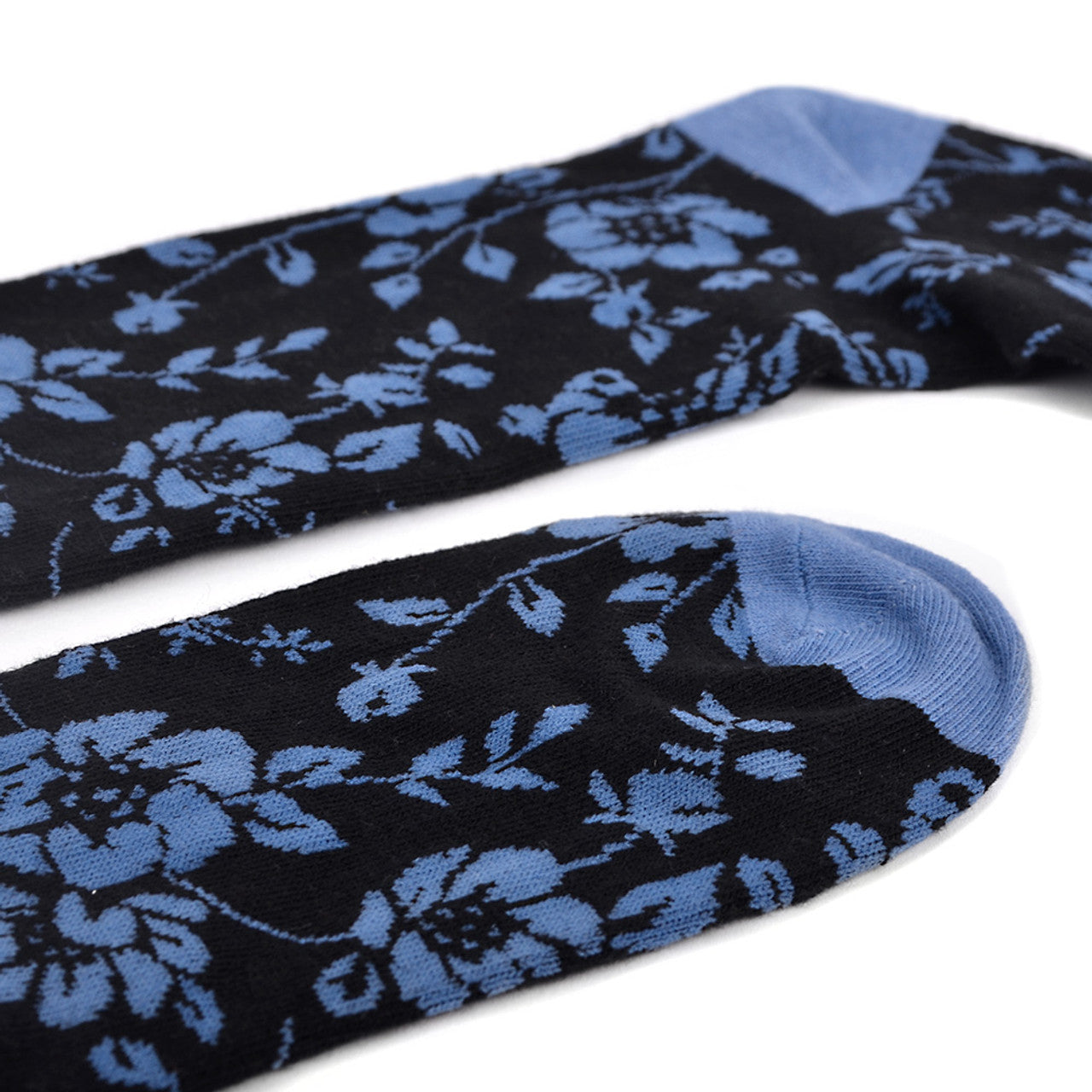 Men's black socks with blue floral and botanical pattern accents, suitable for both garden parties and corporate meetings.