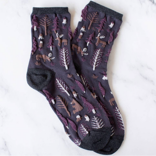 women's plum purple holiday forest socks with brown moose and bear and pine tree textured pattern