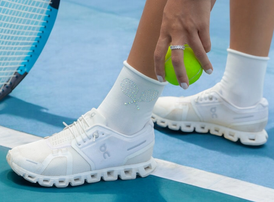 White women's rhinestone tennis socks with a sparkling tennis racquet design, perfect for tennis lovers and players