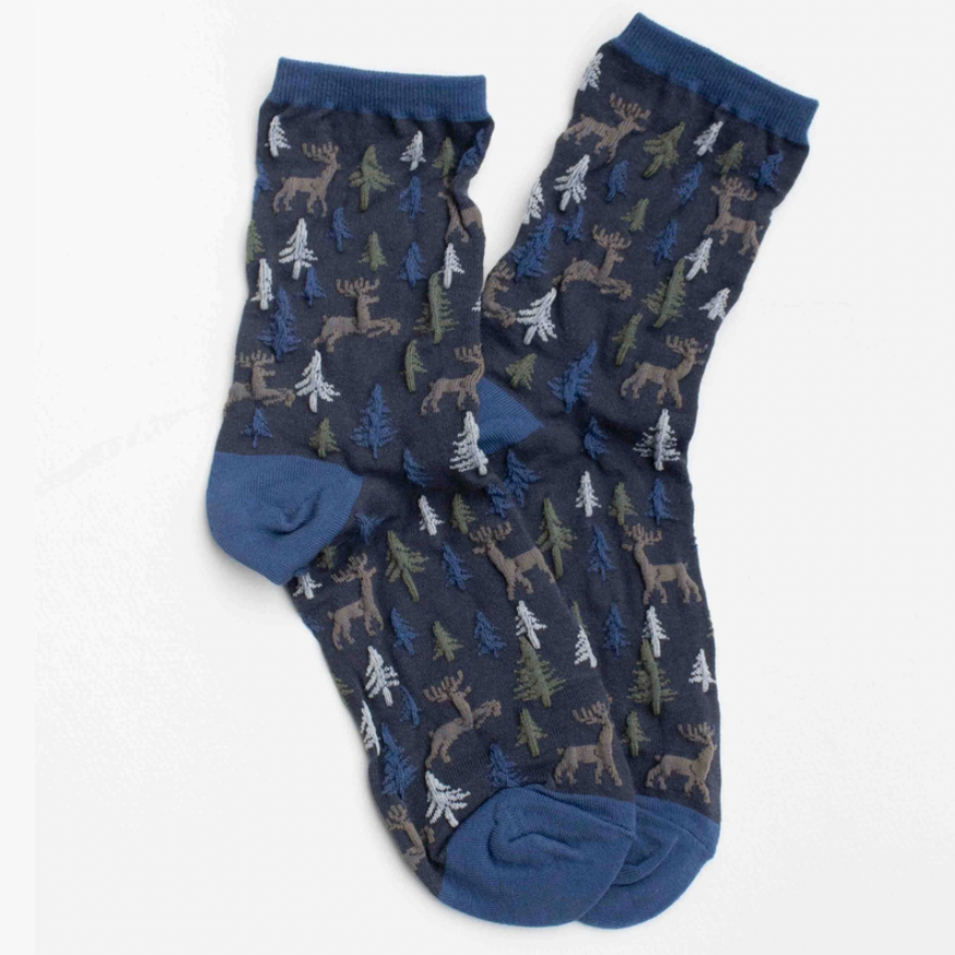 Women's holiday forest socks with deer and pine tree pattern. Blue socks with brown, blue and olive textured design.