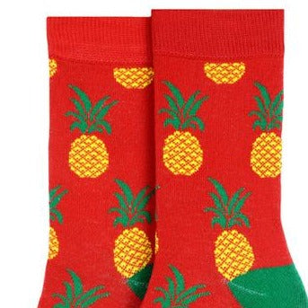 Women's Pineapple Crew Sock. Red sock with green toe and heel. Pineapple pattern allover.